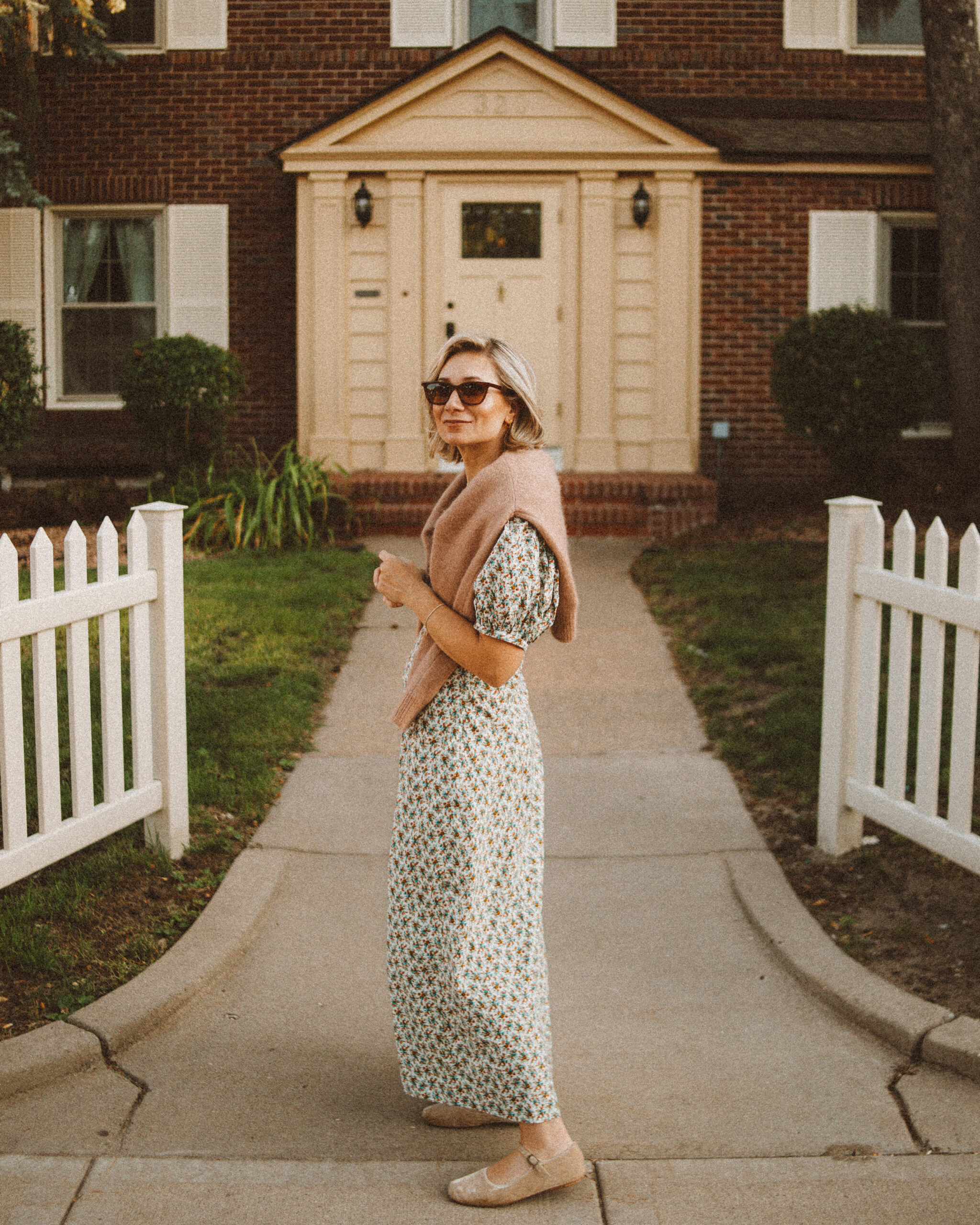 Karin Emily wears her doen favorites for fall: a floral maxi dress and cardigan sweater