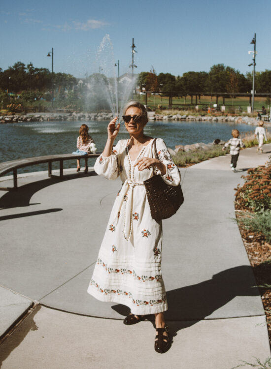 Karin Emily shares style 101 and wears a floral this is the great dress, chunky fisherman shoes, and a bag from dragon diffusion