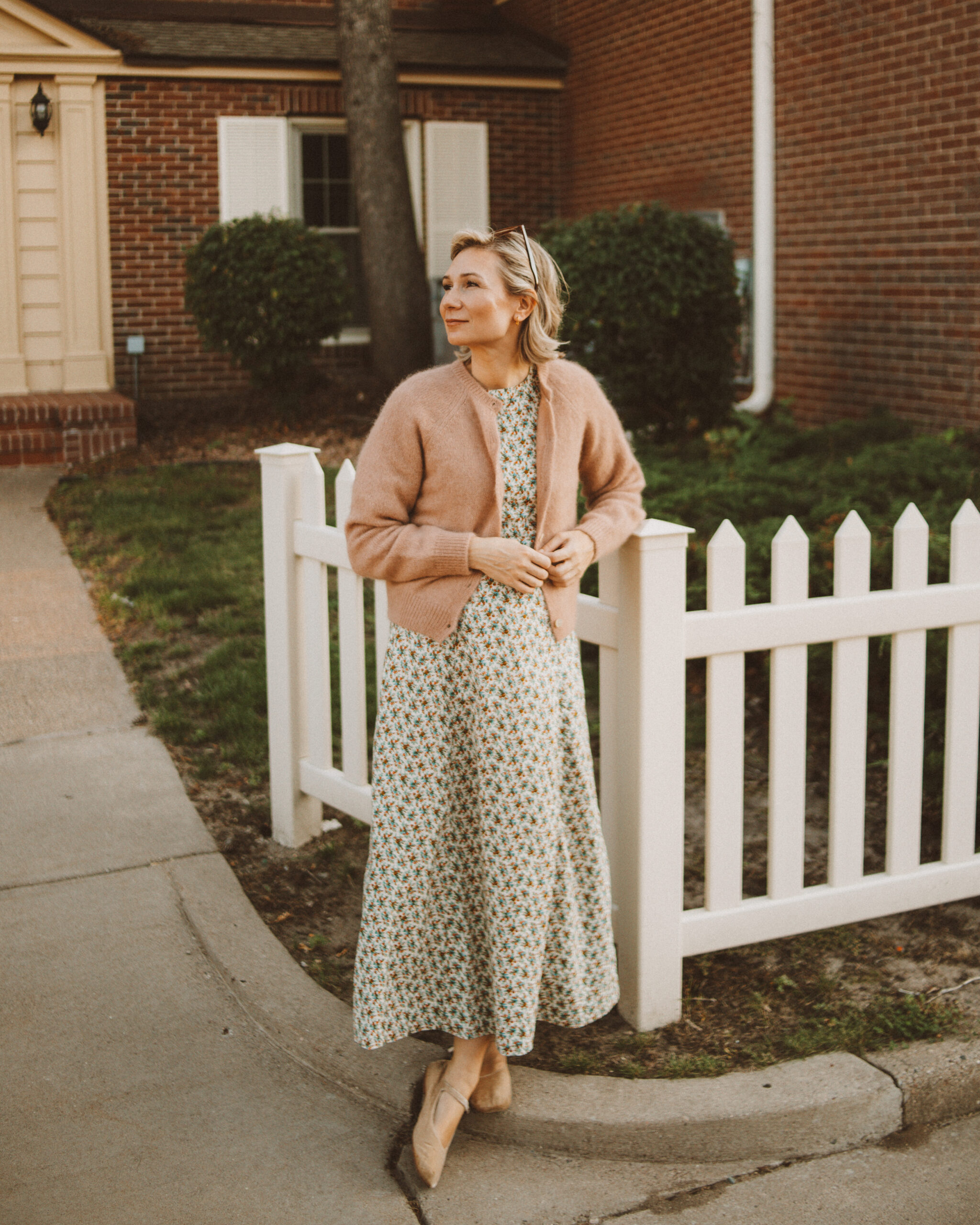 Karin Emily wears her doen favorites for fall: a floral maxi dress and cardigan sweater