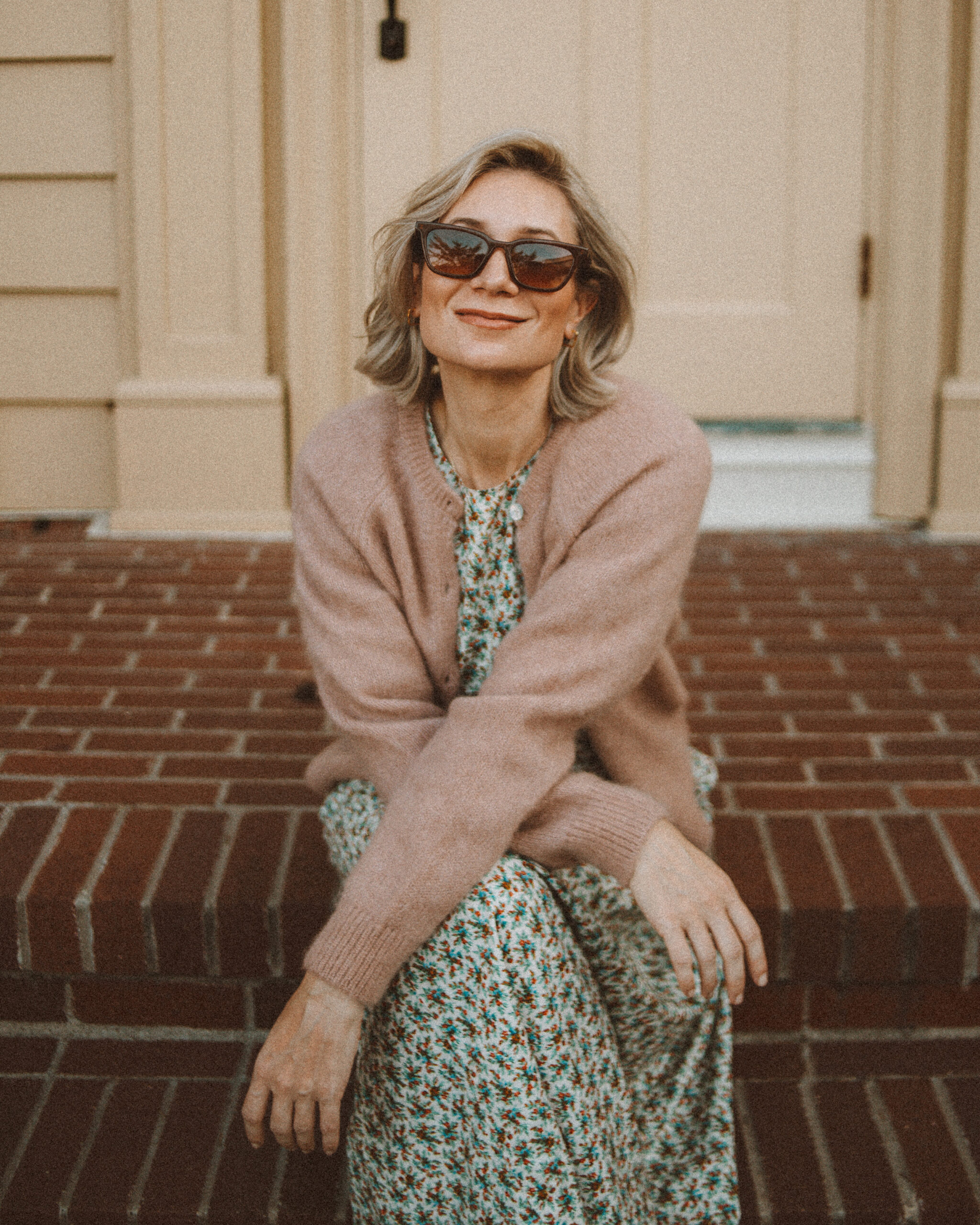 Karin Emily wears her doen favorites for fall: a floral maxi dress and cardigan sweater