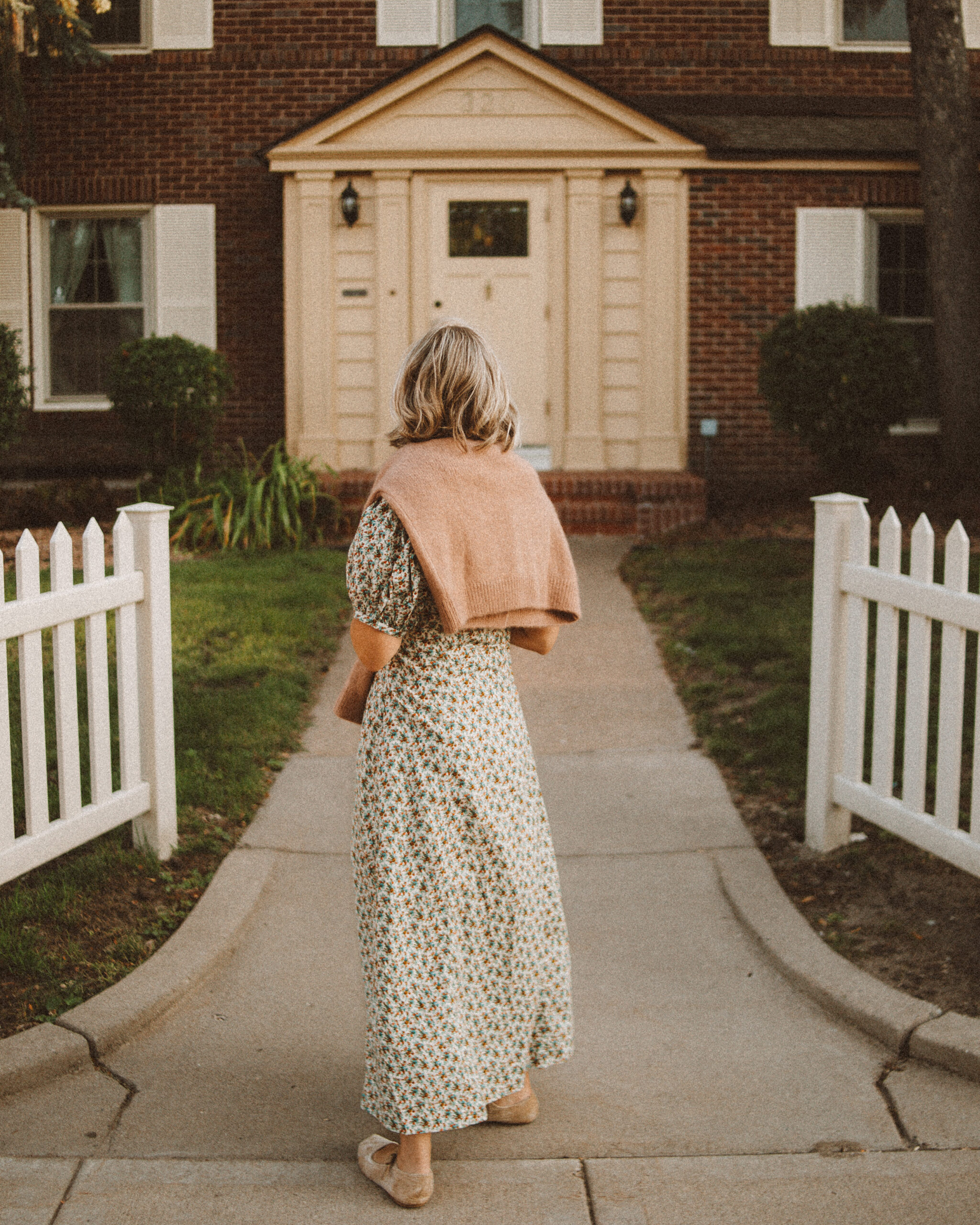 Karin Emily wears her doen favorites for fall: a floral maxi dress and cardigan sweater