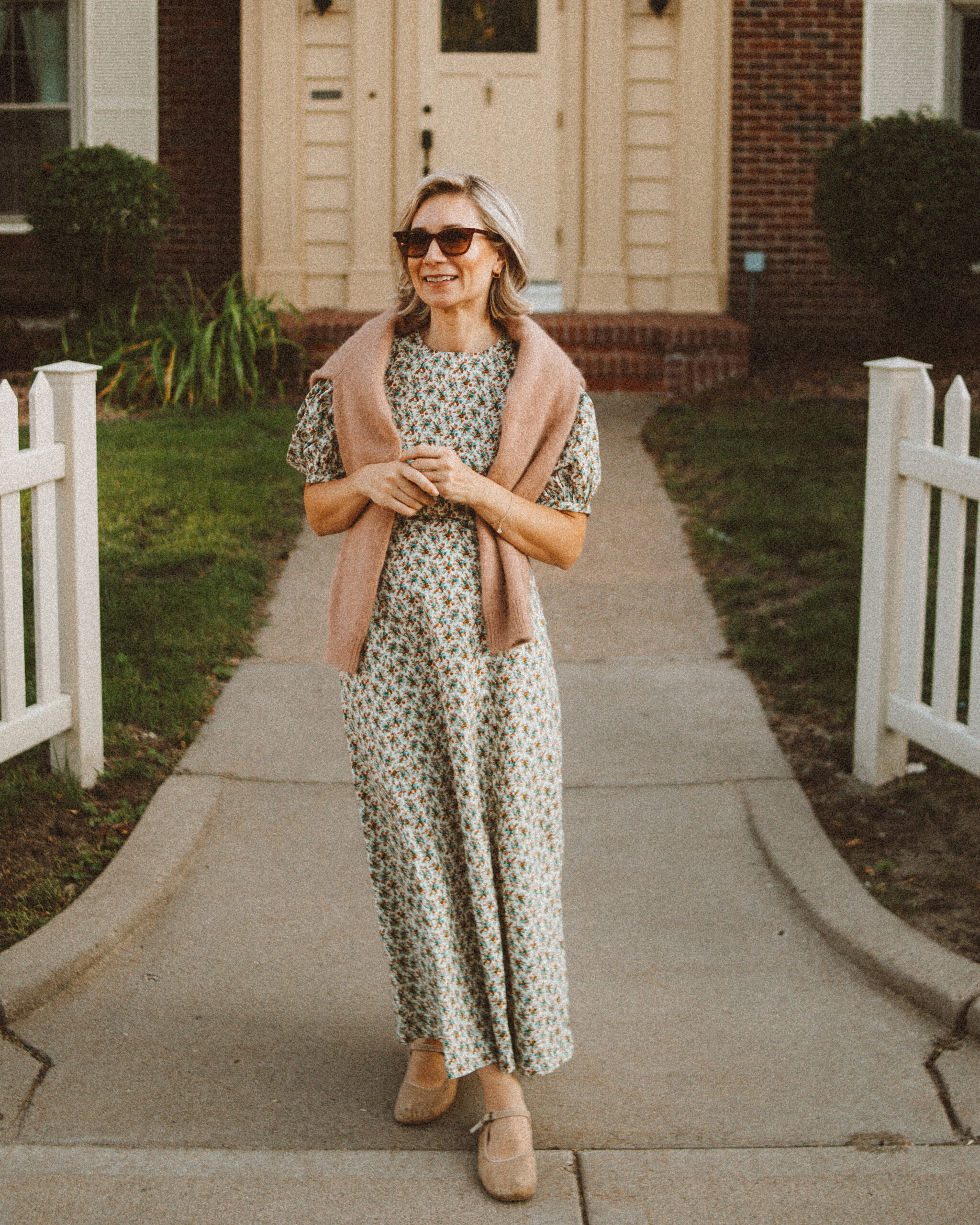 Karin Emily wears her doen favorites for fall: a floral maxi dress and cardigan sweater