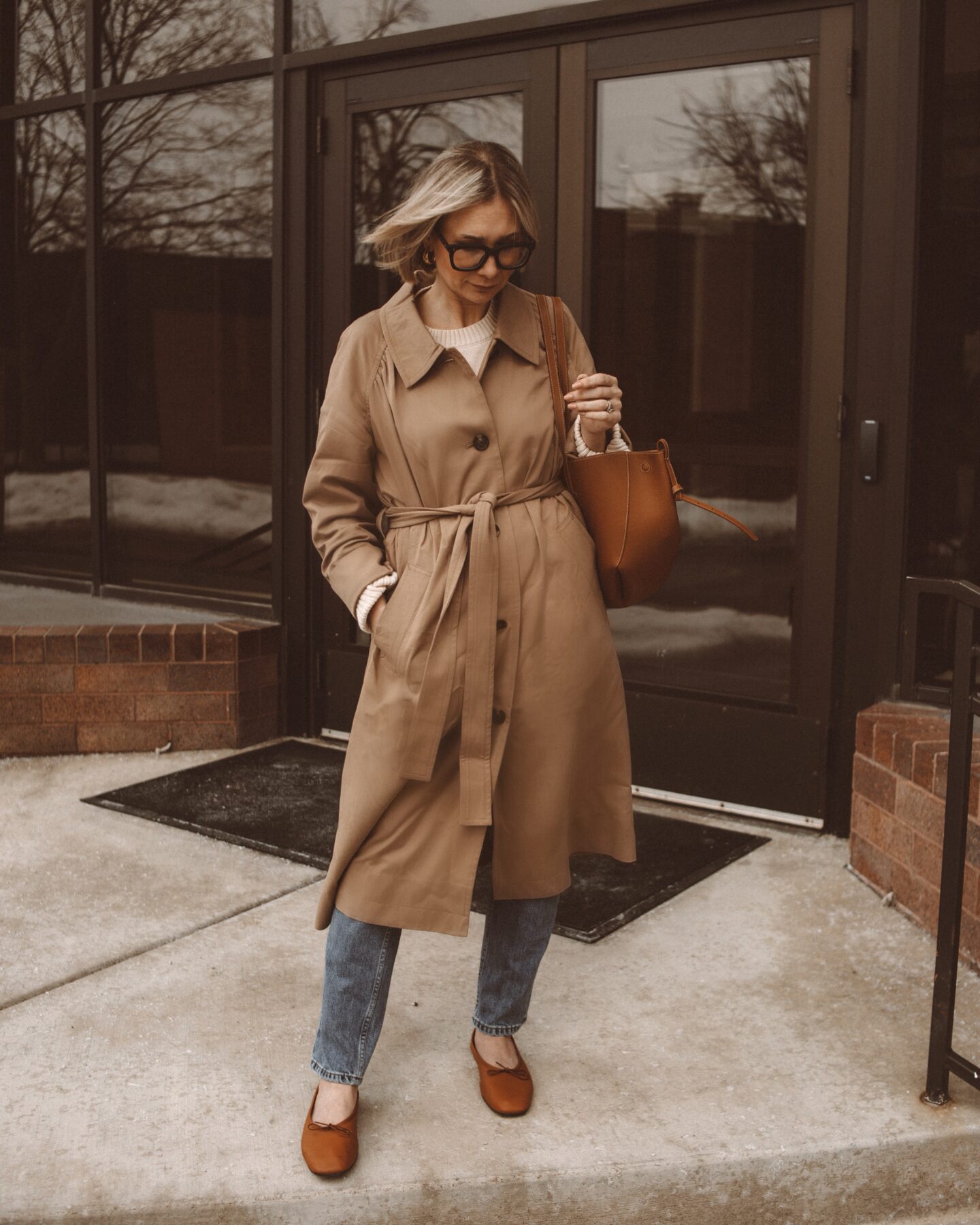 Karin Emily wears and reviews a trench coat, way high slim jeans, and ballet flats from Everlane