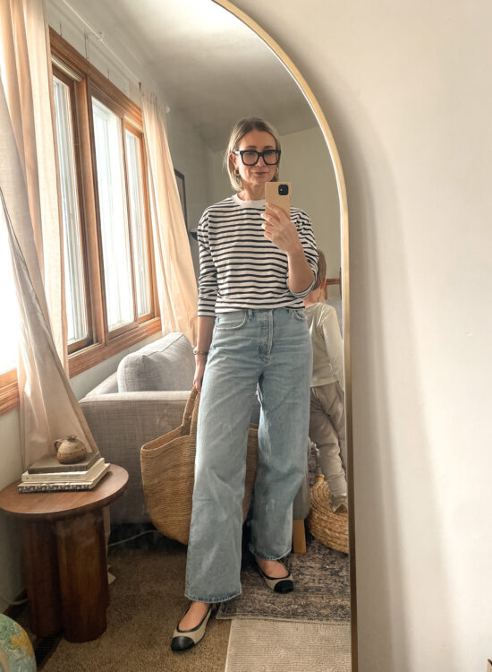 Karin Emily shares a mirror selfie wearing a striped shirt, baggy agolde jeans and two tone flats
