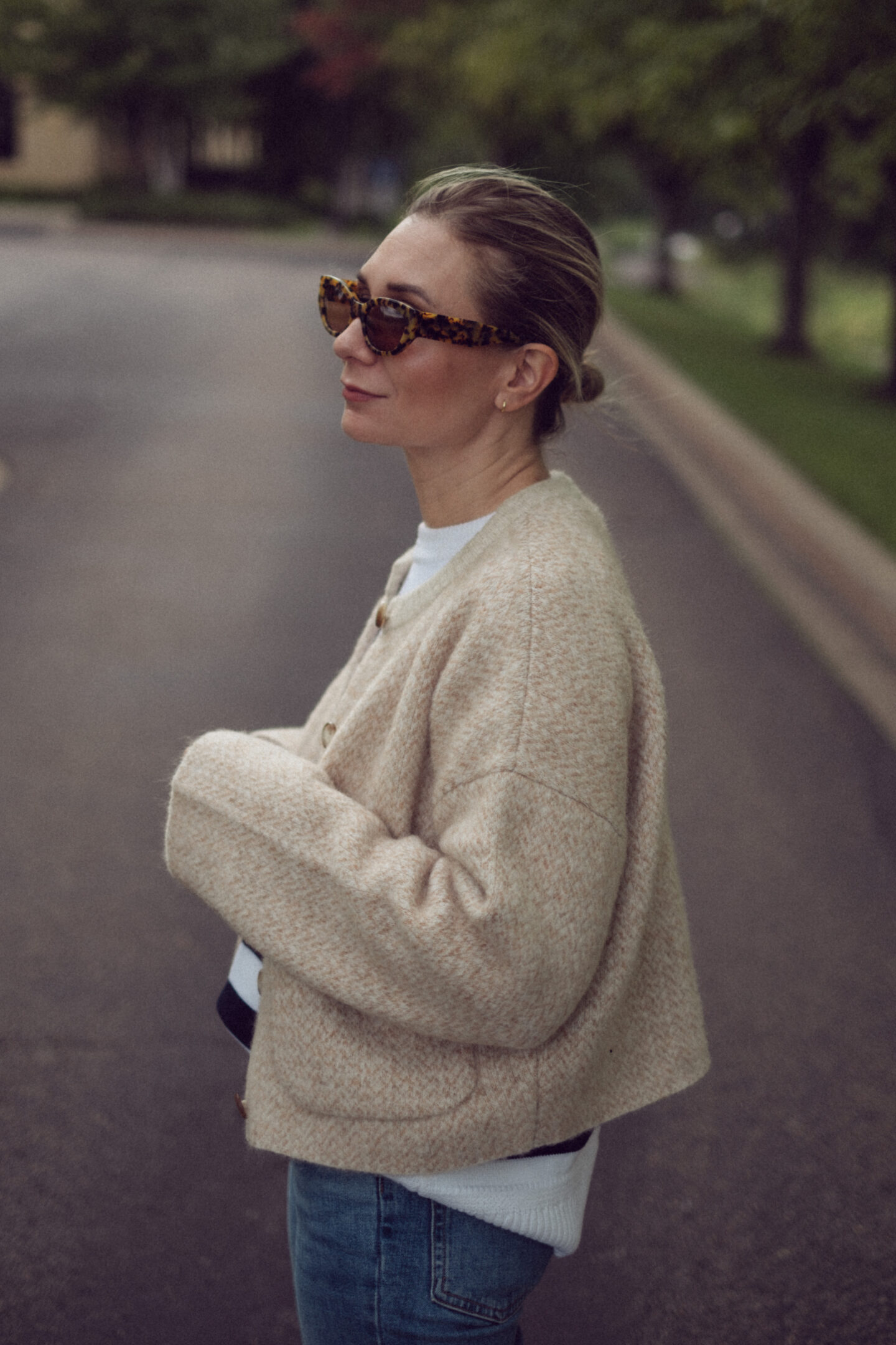 Karin Emily wears an outfit full of new Sezane pieces for fall while standing in the driveway outside of an office building