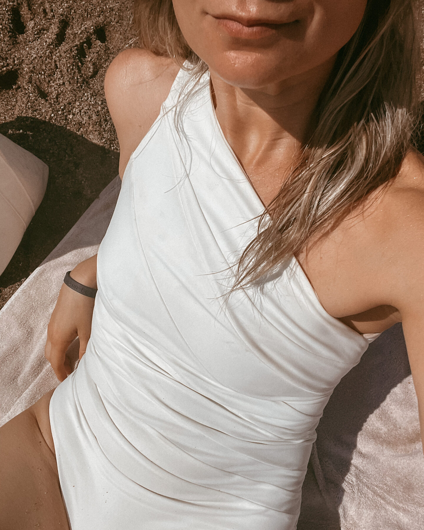 A white one shoulder swimsuit from one of the small businesses I love to support