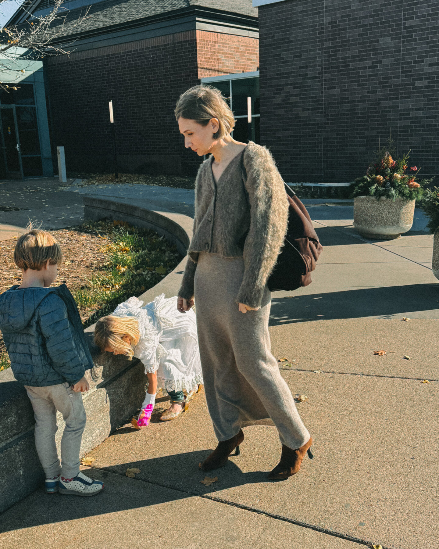 Karin Rambo hangs out with her kids while wearing a sweater skirt and shares Black Friday Sales